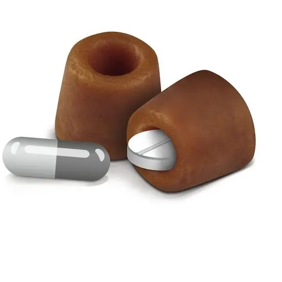 2 royal canin pill assist treats with medication on a white background