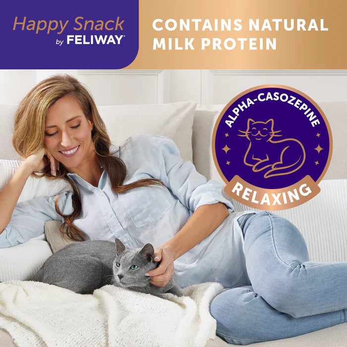 Woman sitting on a couch with a cat, surrounded by branding for 'Happy Snack by FELIWAY' with natural milk protein and alpha-casozepine relaxing elements.