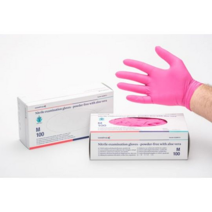 Pink nitrile examination gloves with boxes on a white background