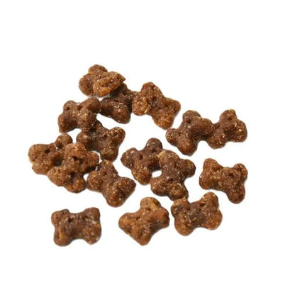 Dog treats shaped like bones on a white background