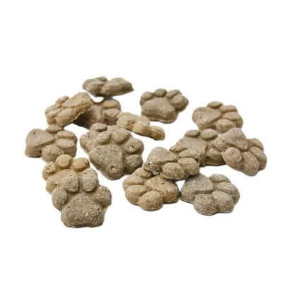 Paw-shaped pet treats on a white background
