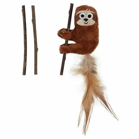 Plush sloth toy with twigs on a white background
