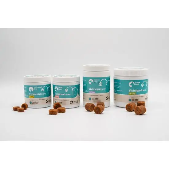 Four containers of vivinicord pet supplements with treats on a white background